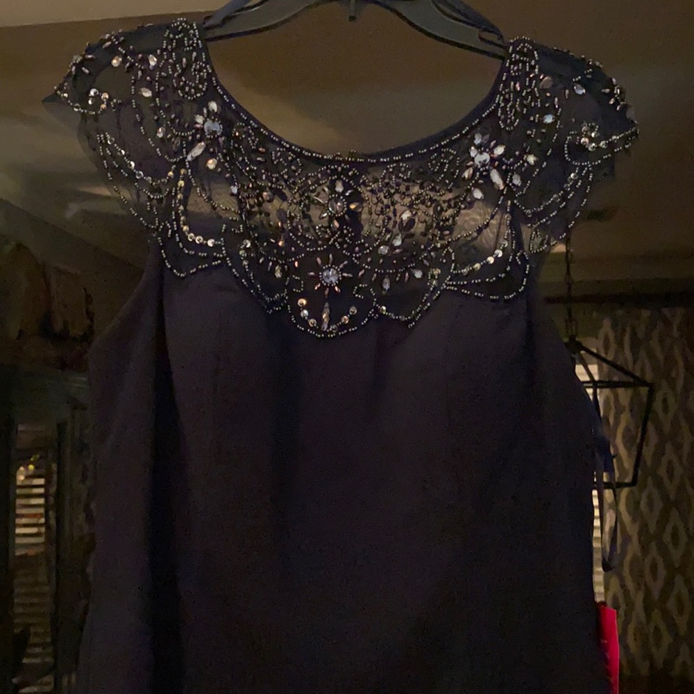 NEW W/ tags. Navy long formal gown with beaded detailing across the neckline.